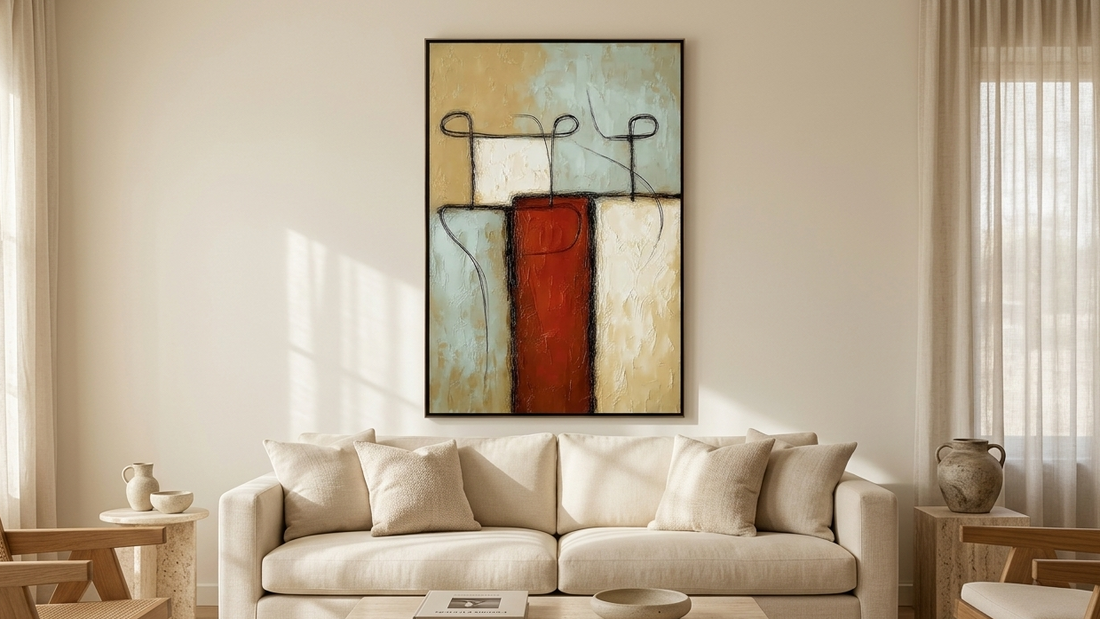Minimalist abstract figurative wall art with textured earthy tones displayed above a sofa in a contemporary living room.