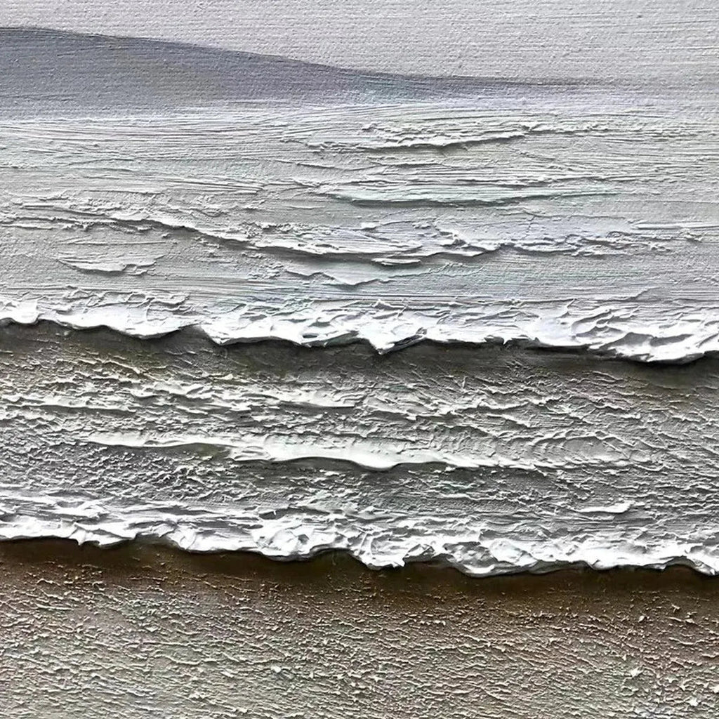 Close-up of 'Whispering Tides' painting showing thick impasto texture of beige sand and white frothy waves.
