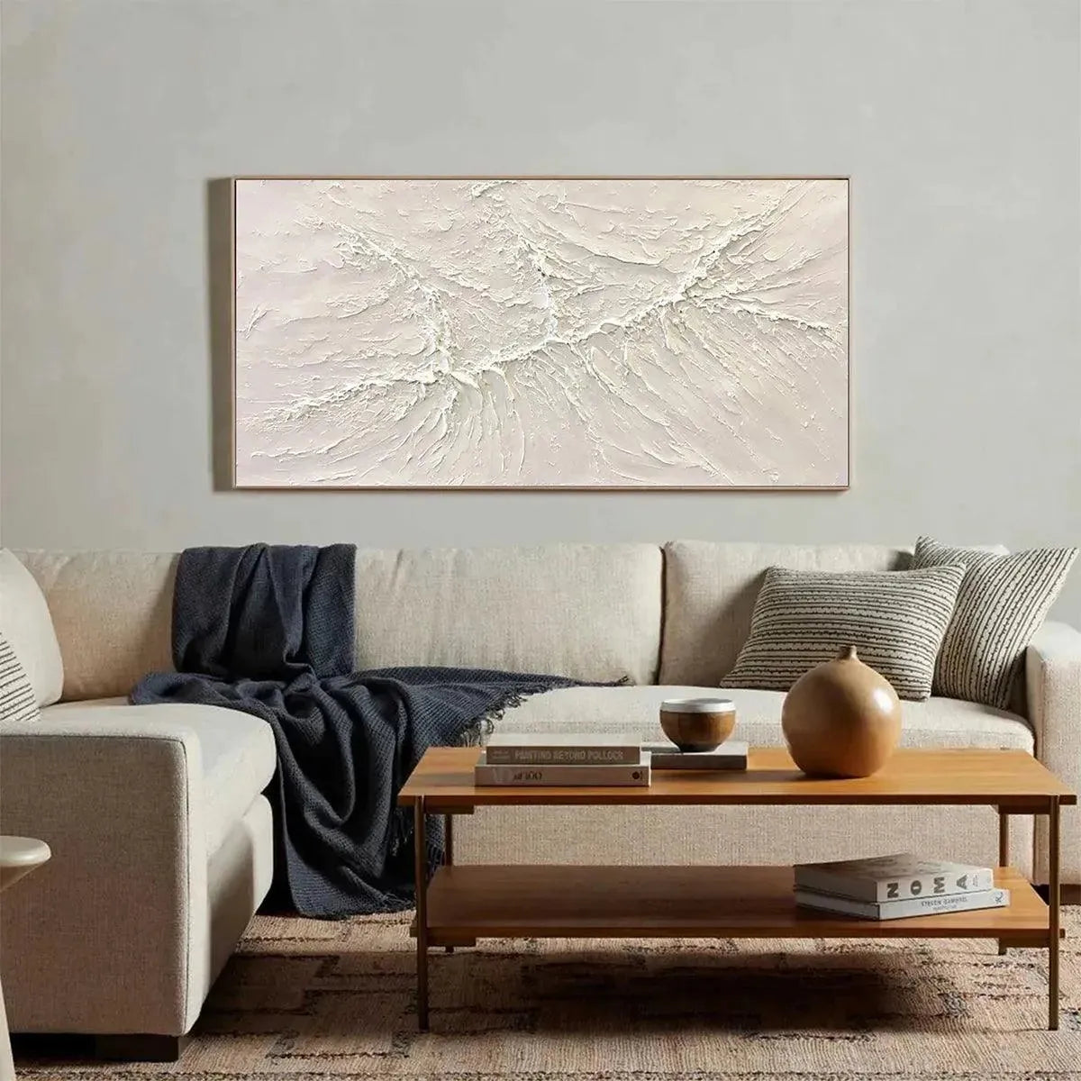 WHITE SANDS abstract painting with impasto texture shown above a sofa in a living room setting.