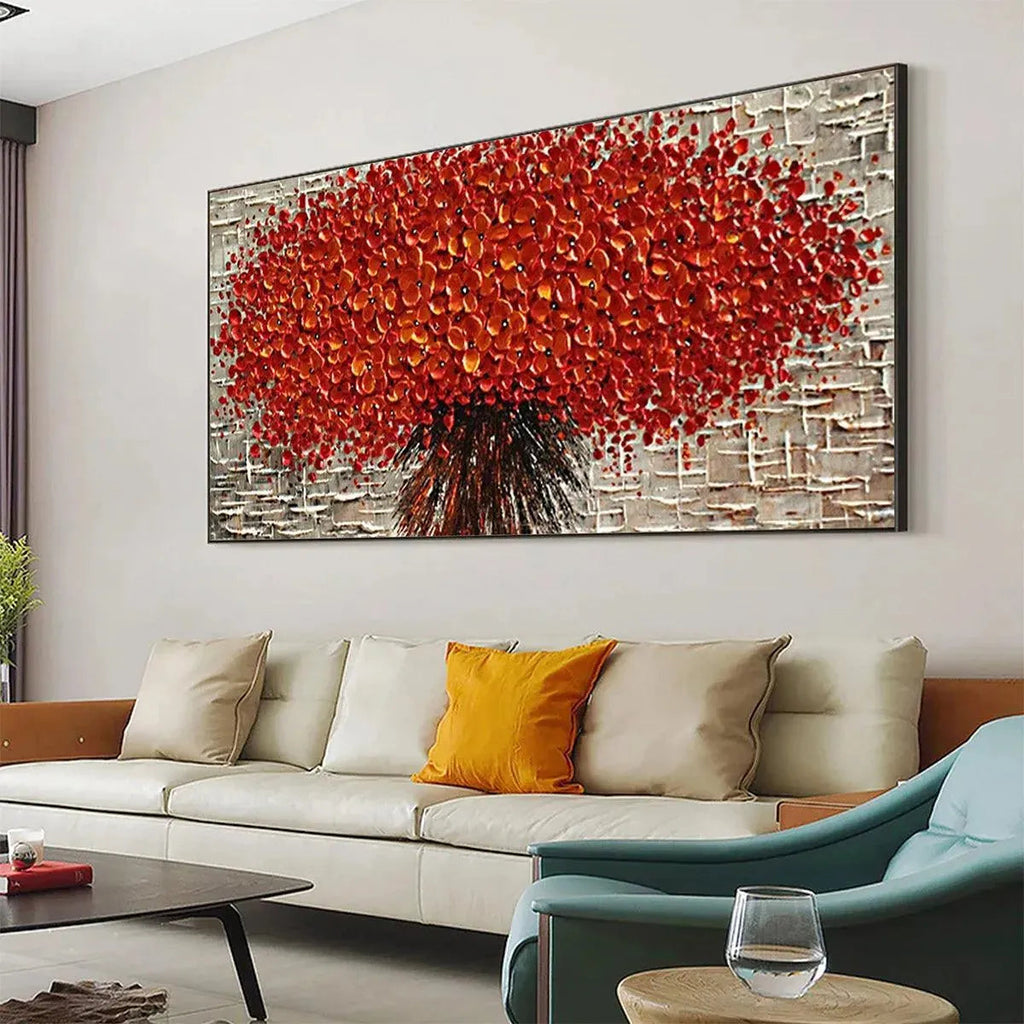 Crimson Burst horizontal textured impasto red floral painting, showing its scale above a modern living room sofa.