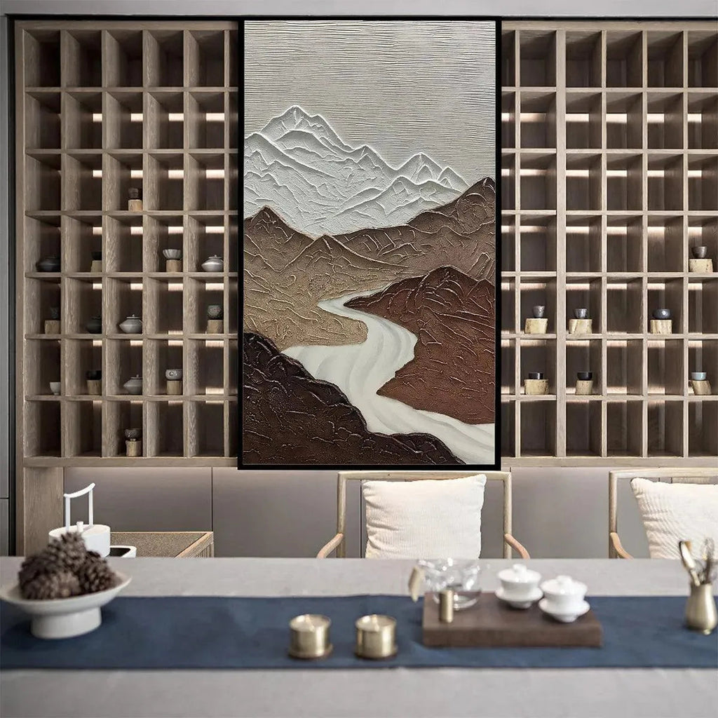 EARTH RIVER: Textured modern wall art with brown mountains, white peaks, winding river in a modern room setting.