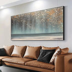 AURORA DUST: Textured abstract ocean painting with gold speckles above a brown leather sofa in a modern living room.