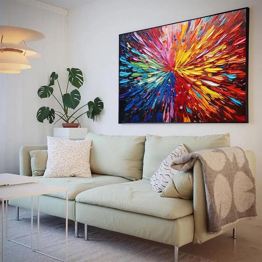 Chak Yu Lam 'Color Explosion' impasto painting with vibrant rainbow hues and textured brushstrokes, displayed above a sofa.