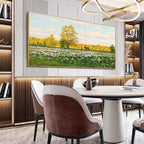 Gold-framed Sunlit Meadow painting: white flowers, golden tree, horse, figure. Ideal for modern dining room decor.