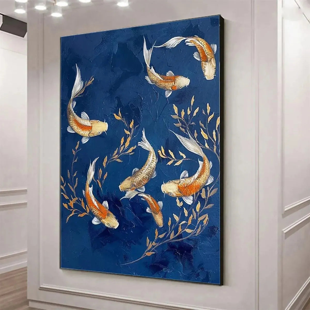 Vertical golden koi painting on blue background with foliage, enhancing a modern white hallway.