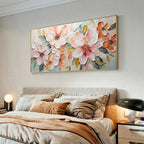 Horizontal impasto painting of peach and white blossoms by Isabella Rossi, displayed above a bed in a lifestyle setting.