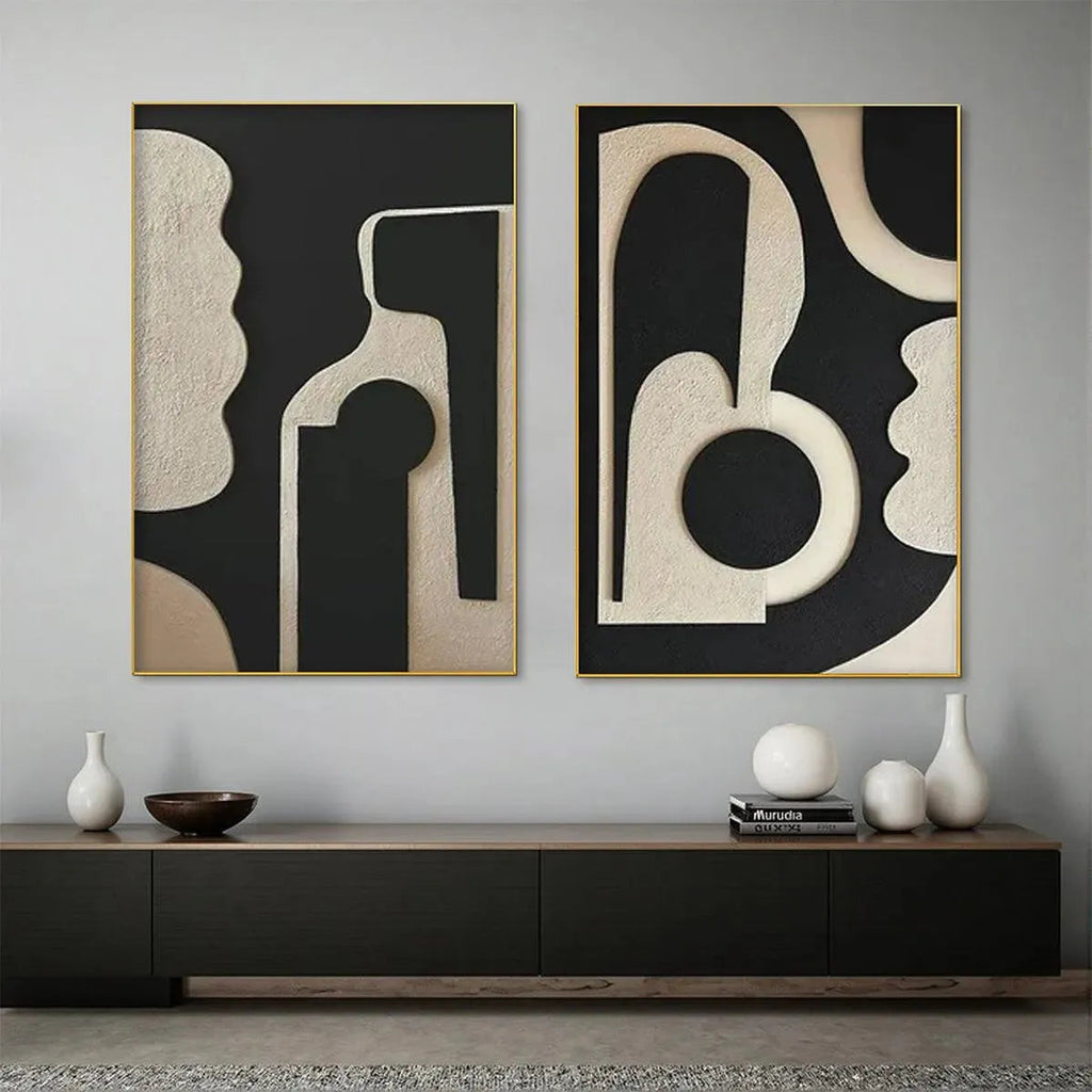 INK BLOT DUO: Two framed abstract paintings with textured beige organic shapes on black background, gold trim.