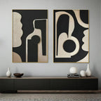 INK BLOT DUO: Two framed abstract paintings with textured beige organic shapes on black background, gold trim.