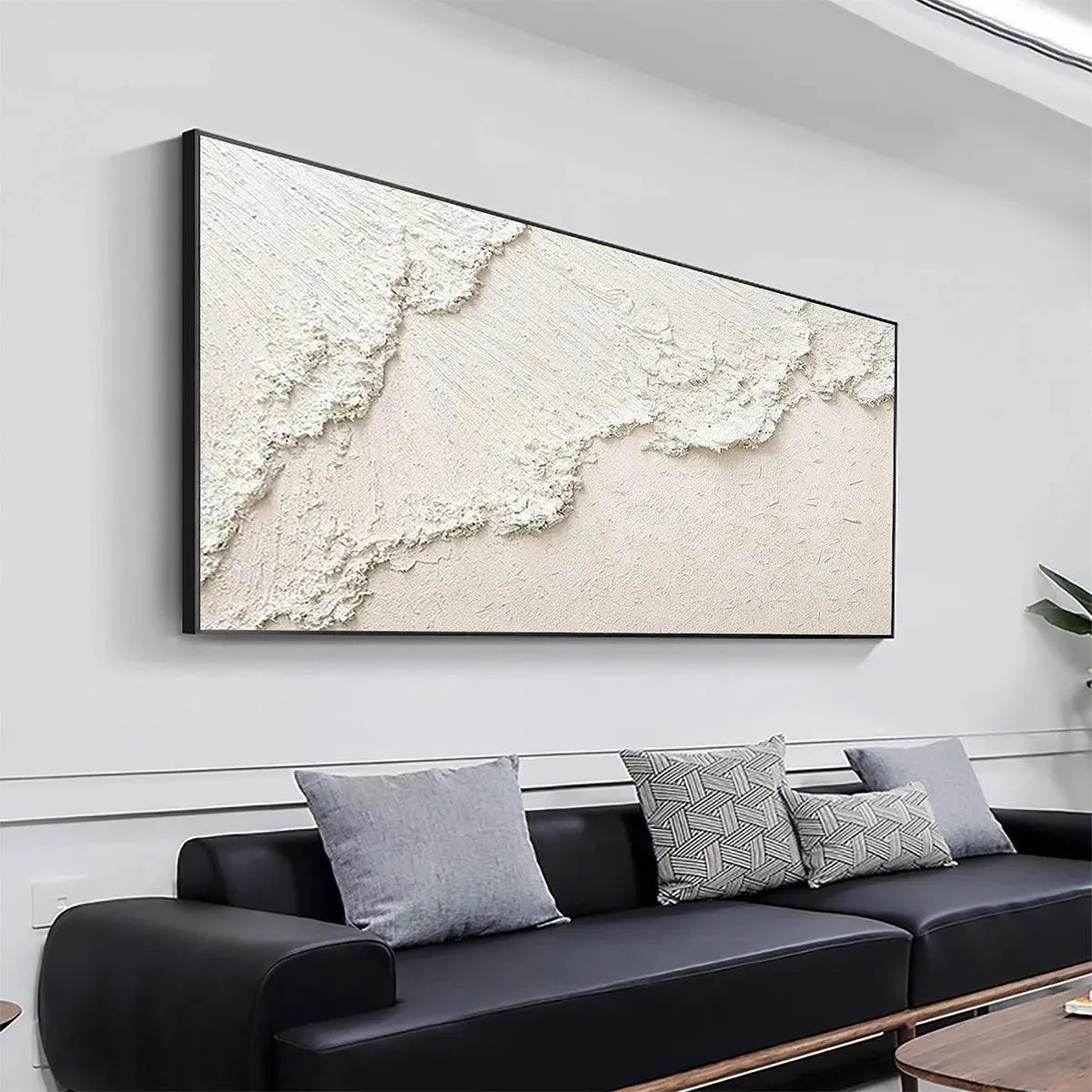 WHITE CREST: Textured white impasto seascape painting by Isabella Rossi. Coastal wall art above modern sofa.