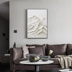 Liam O'Connell textured white mountain impasto painting in black frame, over sofa in modern living room.