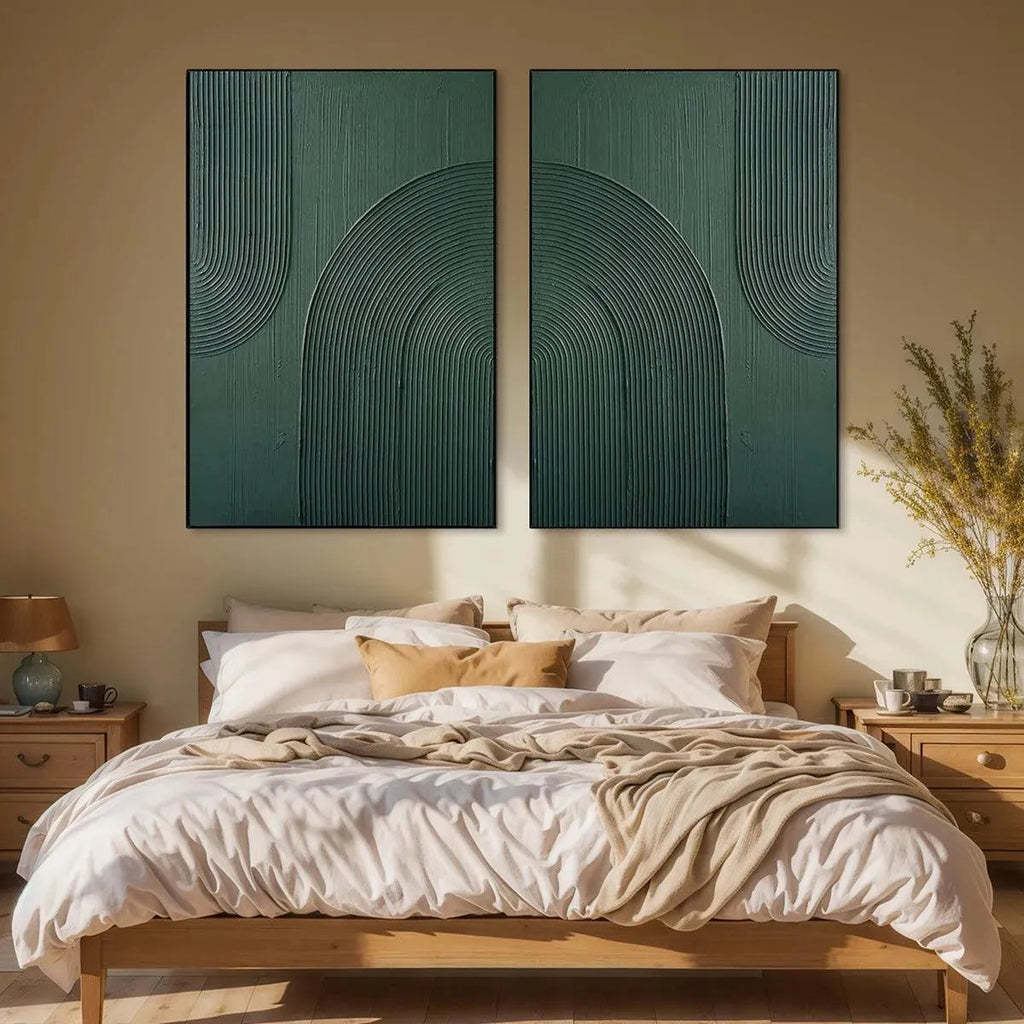 Green Textured Arches Diptych set of 2 abstract paintings displayed in a bedroom above a wooden bed.