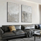 Javier Ramirez Grey Abstract Textured Diptych on a wall, featuring two vertical grey abstract paintings, modern home decor