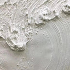 Close-up of Liam O'Connell's Frozen Tide painting showing thick white impasto texture mimicking a wave.