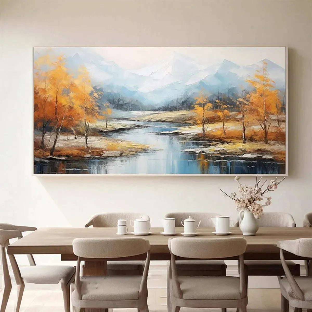 Large Golden Autumn Valley painting in yellow and blue, framed above a modern dining table in a contemporary home.