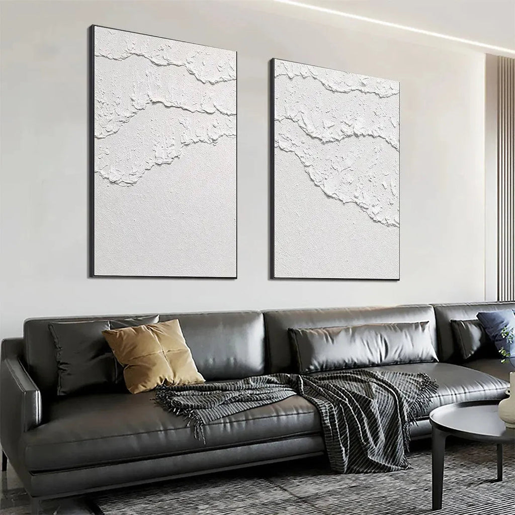 Isabella Rossi's White Waves Diptych: White textured abstract art on canvas, black frame, vertical wall decor.