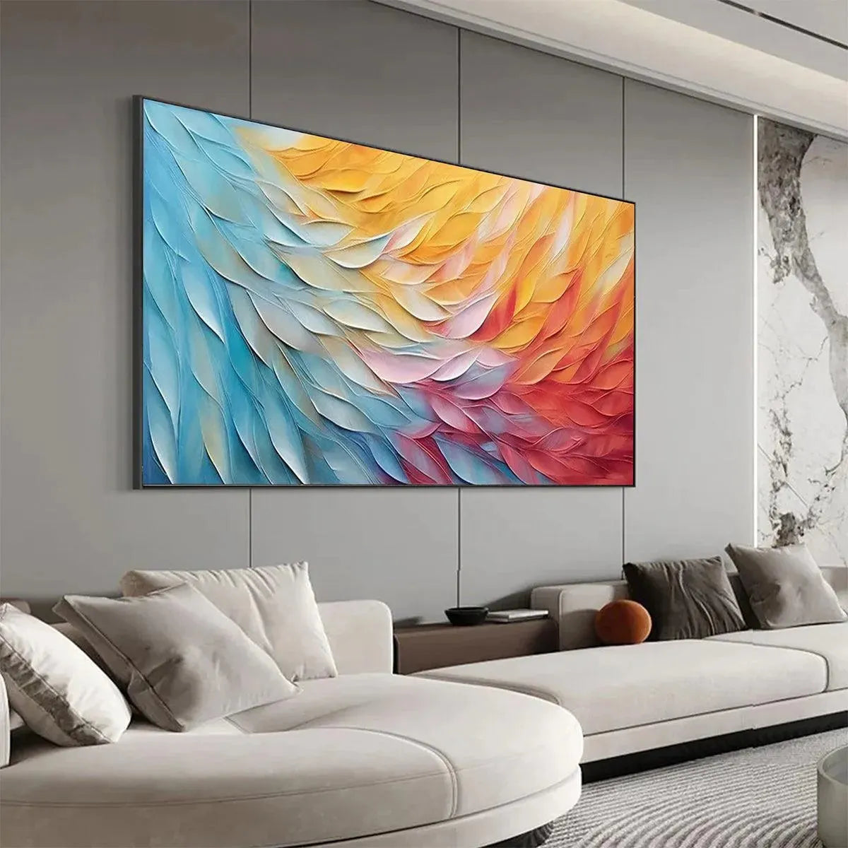 Textured abstract painting "Golden Waves" with impasto strokes in blues, yellows, and reds, above a sofa.