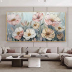Textured impasto painting of pink and white blossoms displayed in a modern living room above a sectional sofa.