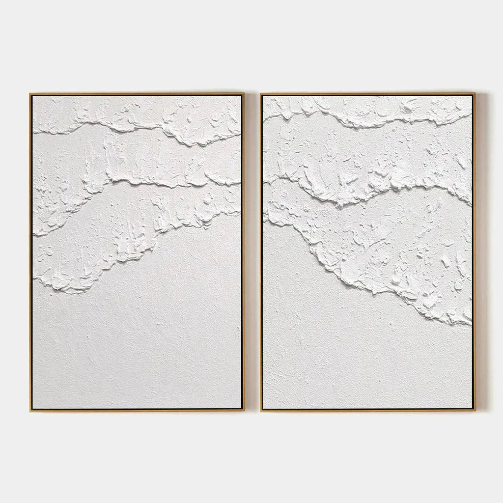 White Textured Waves Diptych by Isabella Rossi, abstract wall art. Textured white impasto on canvas with gold frame.