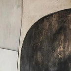 Close-up texture of abstract geometric diptych painting in black and brown tones with subtle linear details.