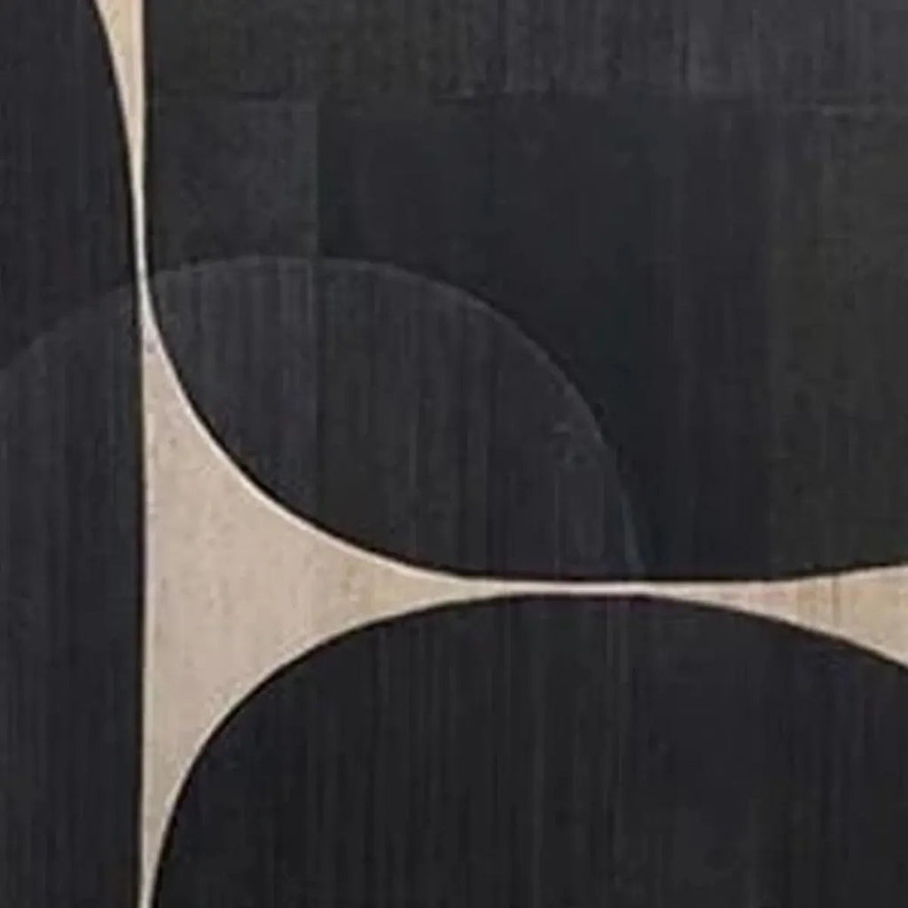 Minimalist abstract art close-up: beige and black geometric shapes with curved lines on textured dark background.