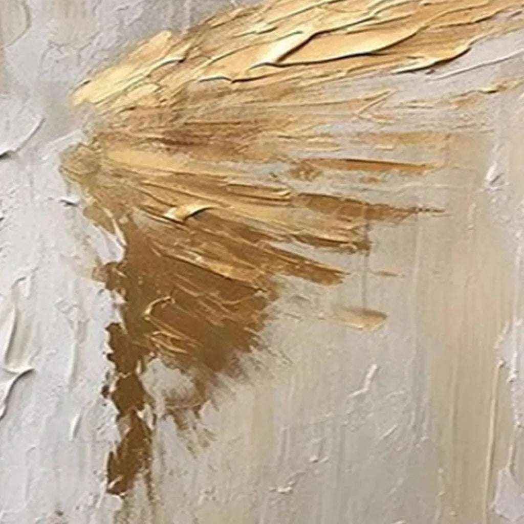 Close-up of textured abstract painting with golden wings on beige background, showcasing impasto detail.