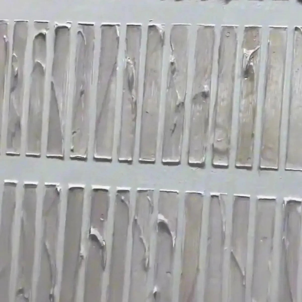 Close-up of Textured Beige minimalist painting, showing rows of thick, uneven beige lines highlighting surface texture.