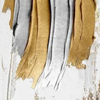 Close-up of Golden Lines Diptych: textured vertical impasto brushstrokes in gold and silver on white background