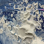 Detail of "Golden Sunset Serenade" painting's impasto: thick, sculptural white foam on deep blue ocean waves.